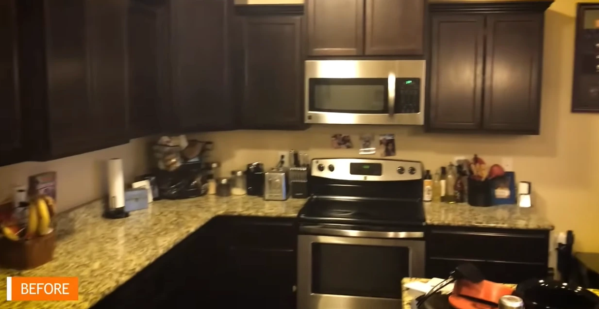 Kitchen before remodeling with dark cabinets