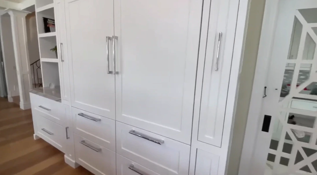 White built-in kitchen cabinets with storage drawers